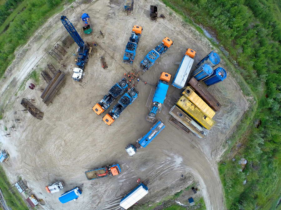 Special equipment performs the procedure for placing equipment for the production of hydraulic fracturing of the oil reservoir on the oil layer in Western Siberia.