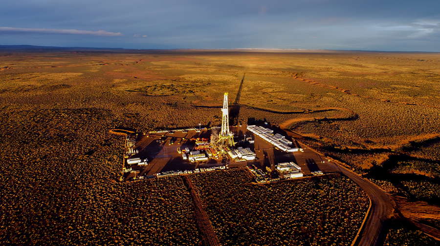 Aerial photo of hydraulic fracturing equipment at sunset. (FRACKING)